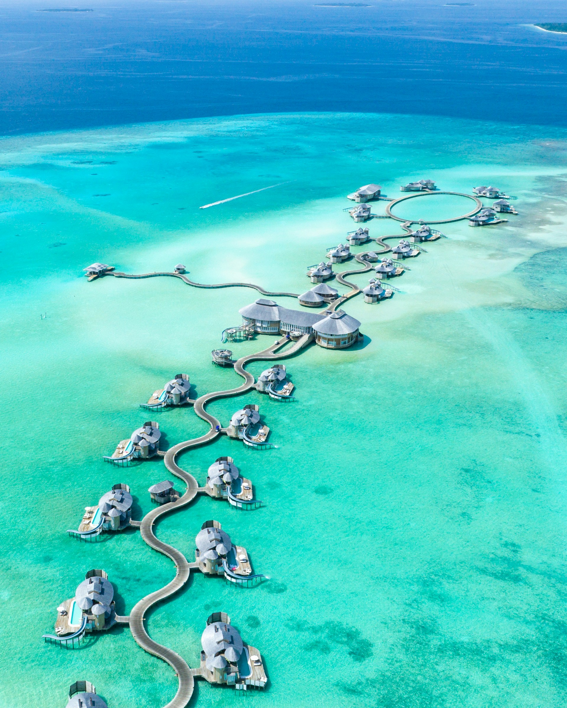 Overwater villas surrounded by the turquoise lagoons of the Maldives